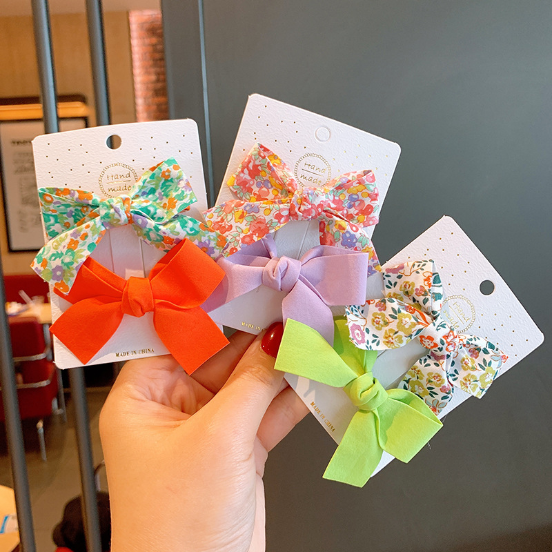 Kẹp tóc cho bé gái set 2 chiếc đính nơ rất dễ thương PK36 - Cam