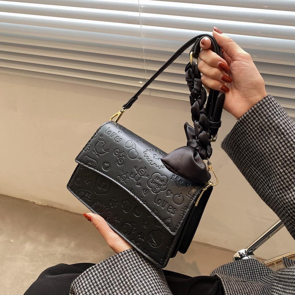 Túi da nữ họa tiết in chìm kute - MA279