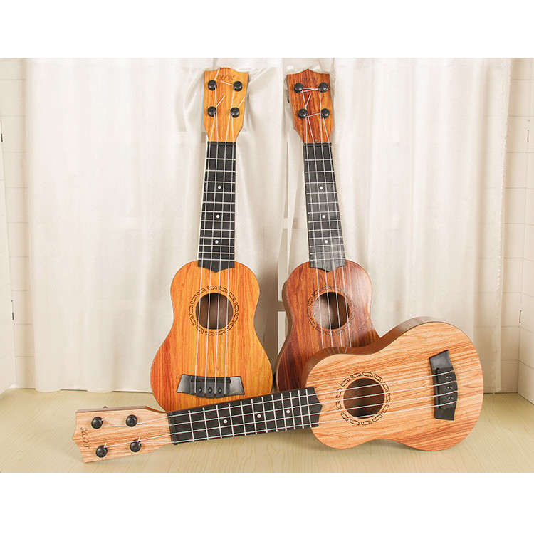 Đồ chơi đàn guitar mini vân gỗ cho trẻ tập chơi đàn