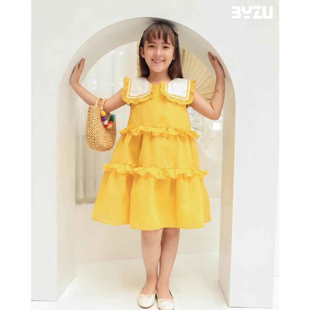 Váy đầm bé gái BYZU, chất vải xốp màu vàng tươi, thiết kế 3 tầng sành điệu (Daisy Dress)