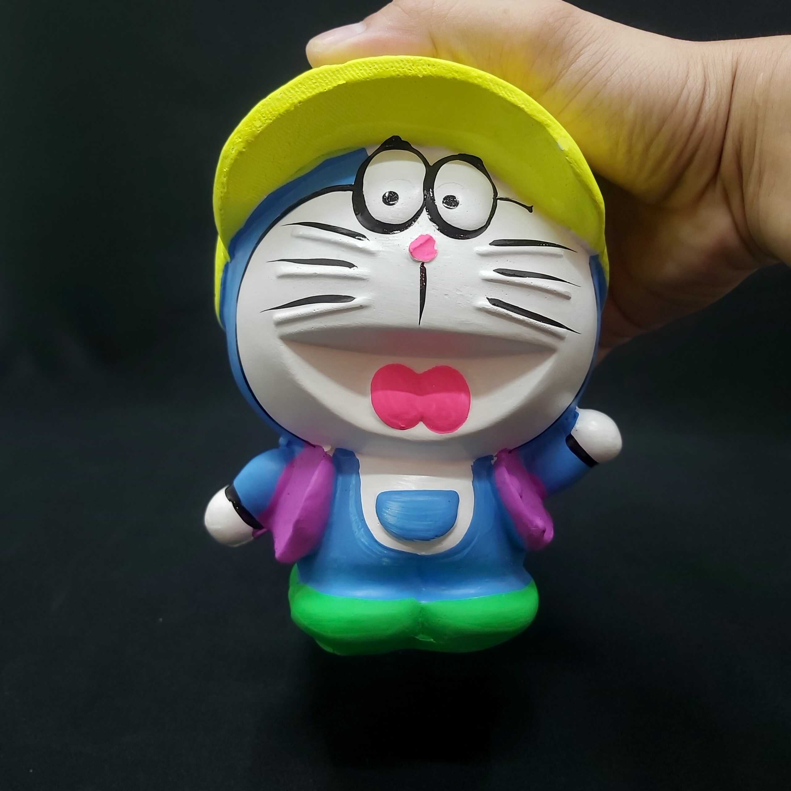 ống heo tiết kiệm tiền nhỏ mẫu DORAEMON Đội Nón cực HOT – heo đất làm quà tặng sinh nhật được trẻ em yêu thích (màu ngẫu nhiên)