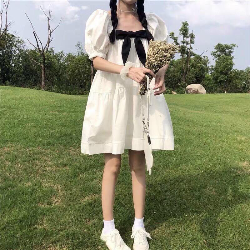 Váy đầm nữ dáng babydoll màu trắng cột nơ cổ tay bồng nữ tính