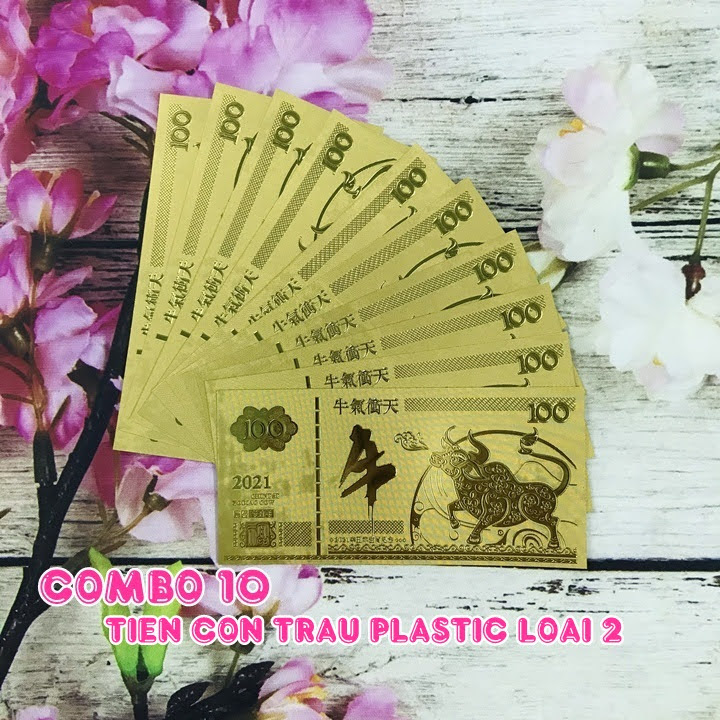 Combo 10 tờ lưu niệm 100 hình con Trâu màu vàng, chất liệu nhựa plastic (loại 2), dùng để trang trí trong nhà, treo cây hoa mai, làm tiền lì xì, quà mừng dịp Lễ, Tết 2021 - TMT Collection - SP005097