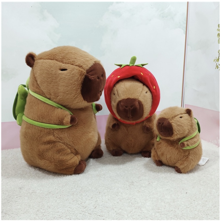 Thú nhồi bông capybara đội mũ dâu tây đáng yêu - Size từ 35cm đến 85cm - Quà tặng gấu bông capybara mang balô dâu tây trên lưng - Gối ôm chuột lang dễ thương cho bé