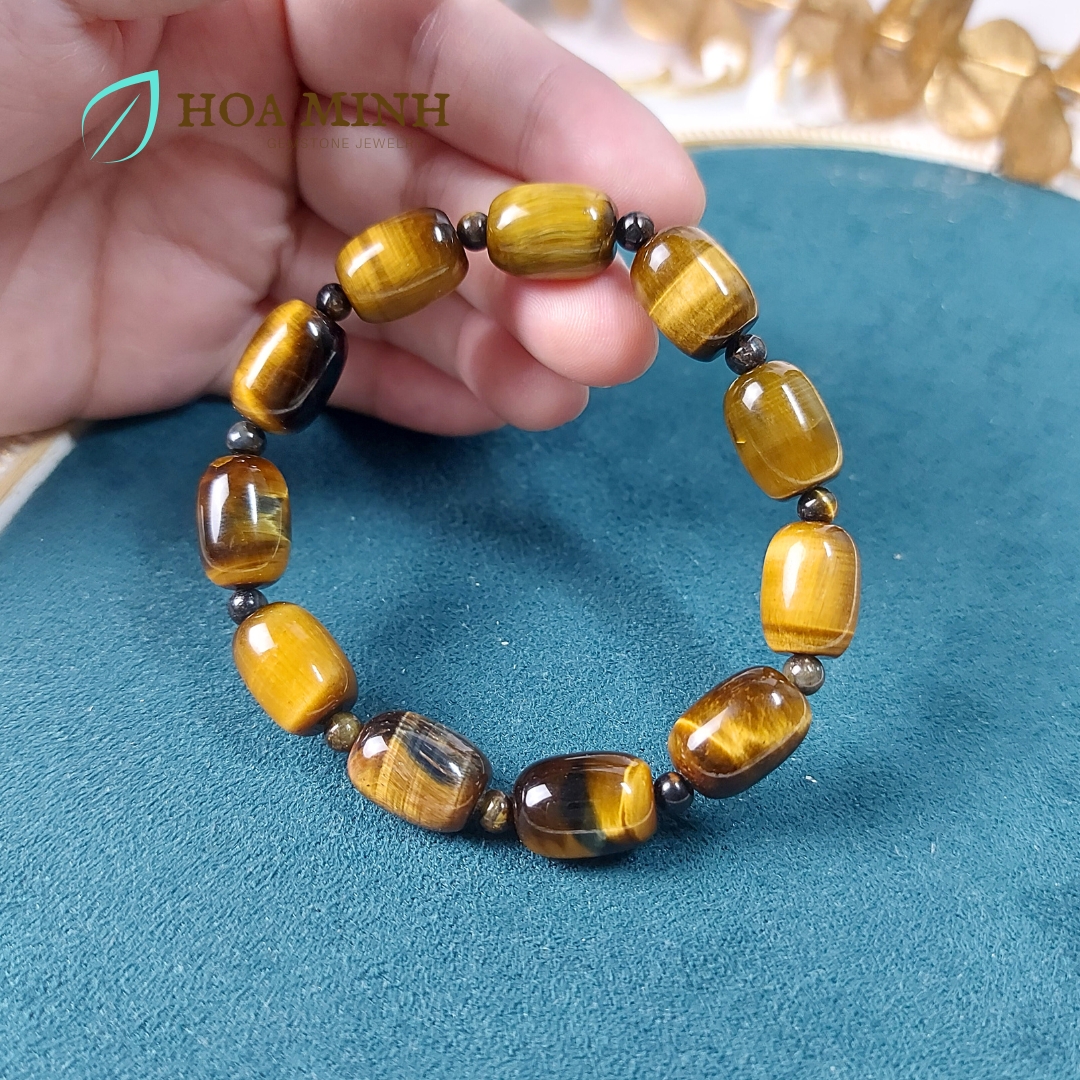 Vòng tay đá Mắt Hổ vàng nâu size 14x10 li chất 4A kiểu lu thống phối xen kẽ viên mắt hổ tròn