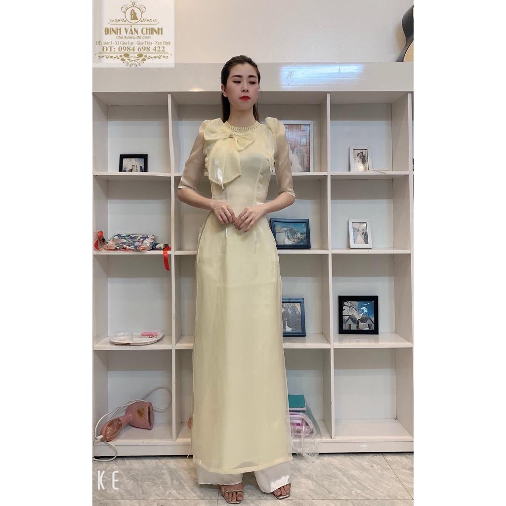 Áo dài tơ sống nơ ngực điểm trai full cổ màu da sáng