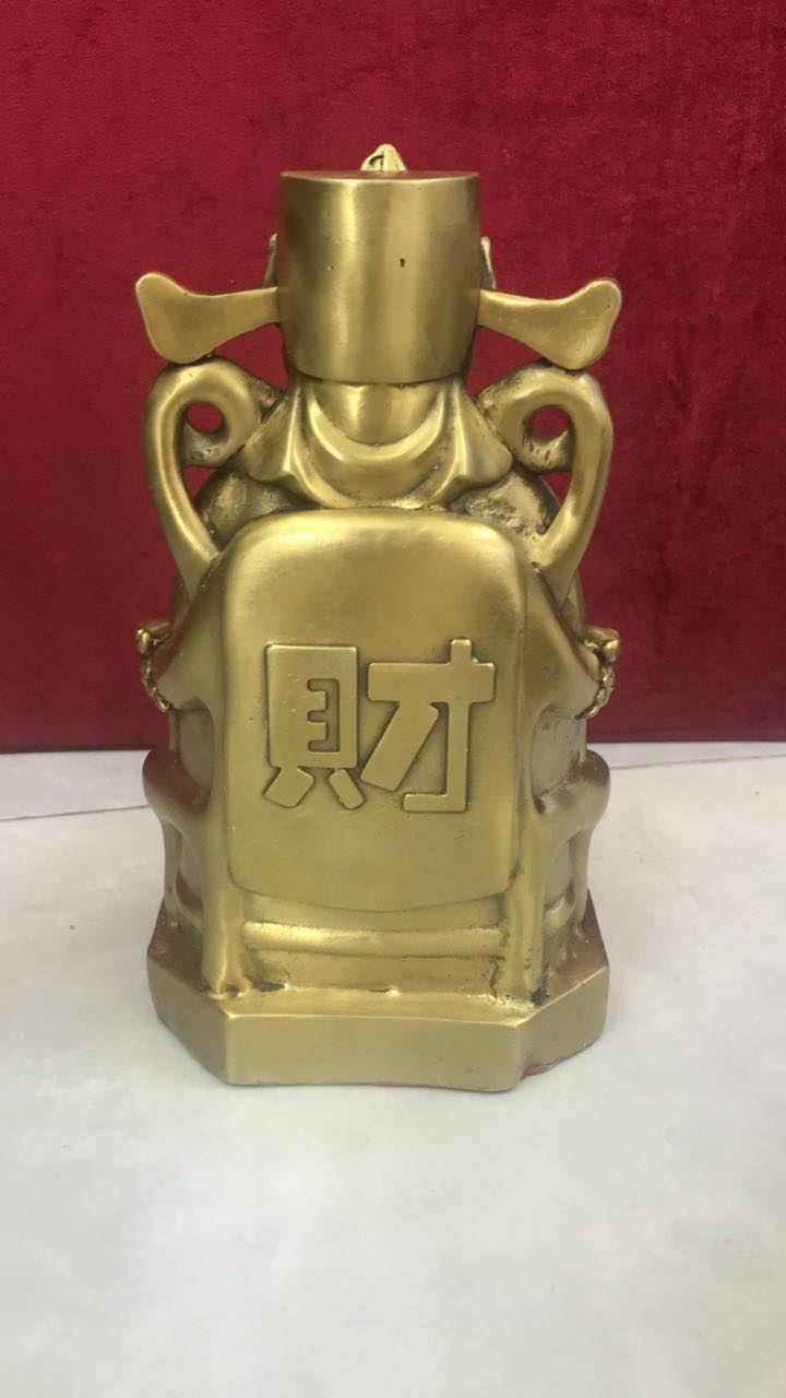 Thần tài ngồi bằng đồng