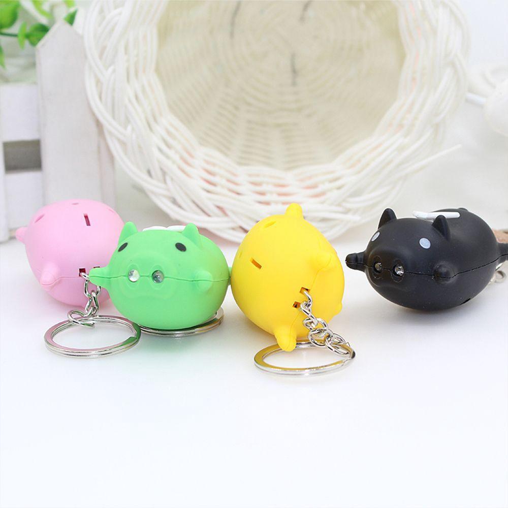 Móc khóa hình con heo có đôi cánh thiên thần phát sáng đèn Led có nhạc có đèn-Móc khóa hình heo phát sáng