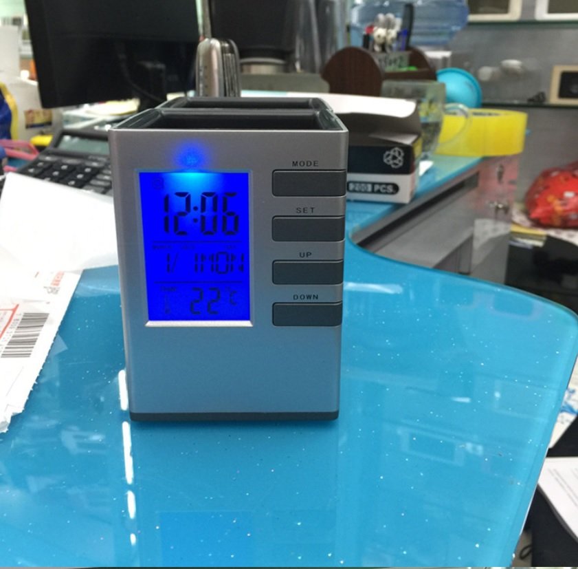 Đồng hồ báo thức,đo nhiệt độ kiêm giá đựng bút để bàn thông minh DHB002