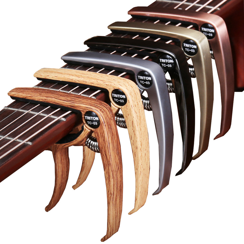 Capo Đàn Guitar/Ukulele Vân Gỗ Woim TC-03 ( Màu ngẫu nhiên )