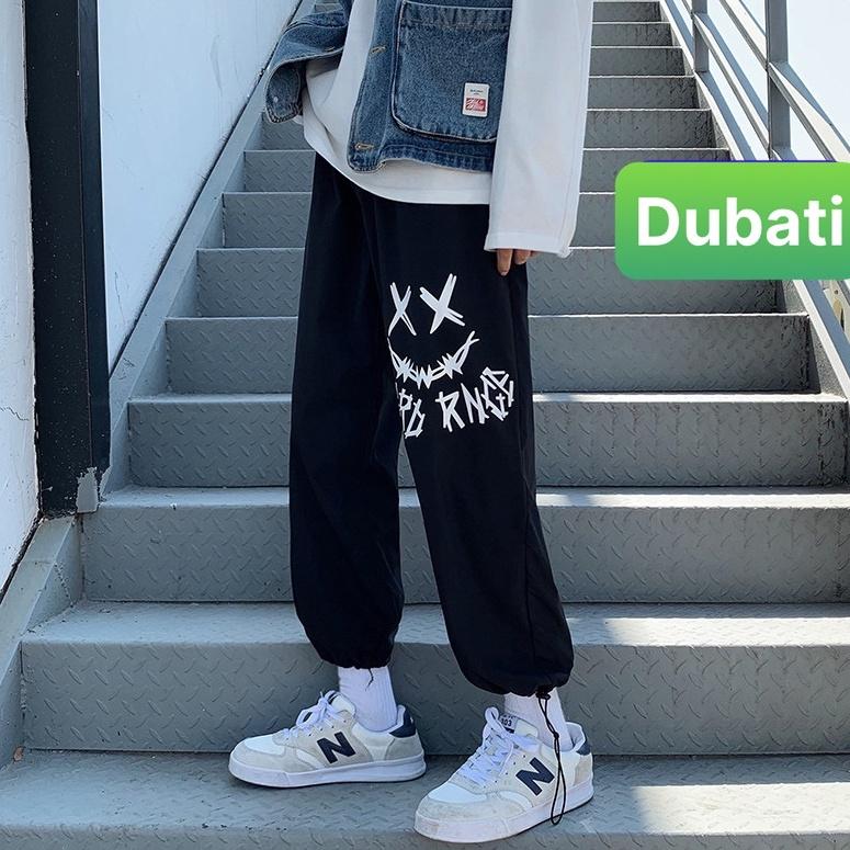 QUẦN JOGGER NAM NỮ UNISEX CHẤT NỈ DÀY DA CÁ ỐNG SUÔNG RỘNG IN HÌNH MẶT CƯỜI RÚT DÂY PHONG CÁCH HOT TREND MÙA HÈ - DUBA