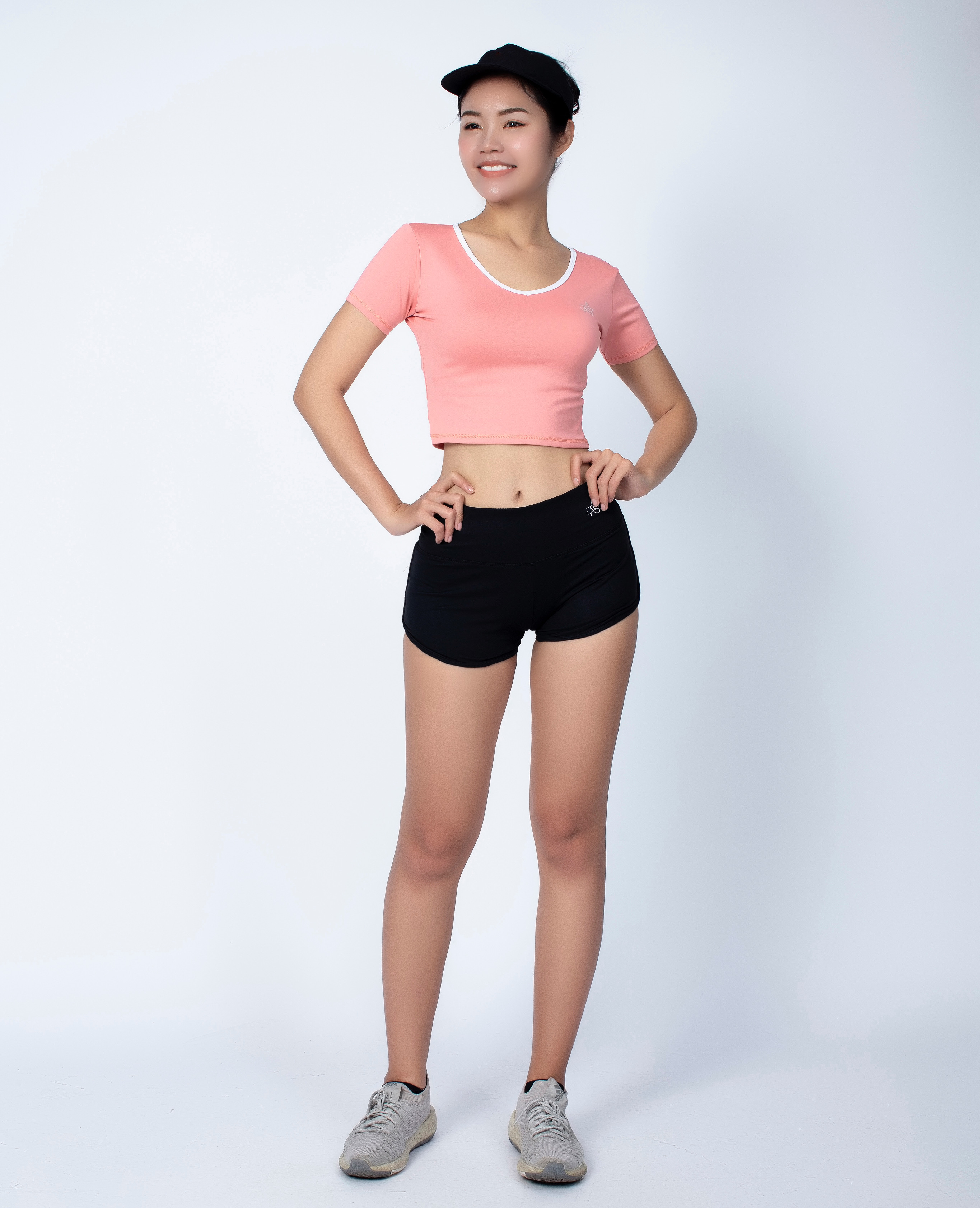 Bộ thể thao nữ quần short chữ V áo croptop có tay màu Cam - DN110