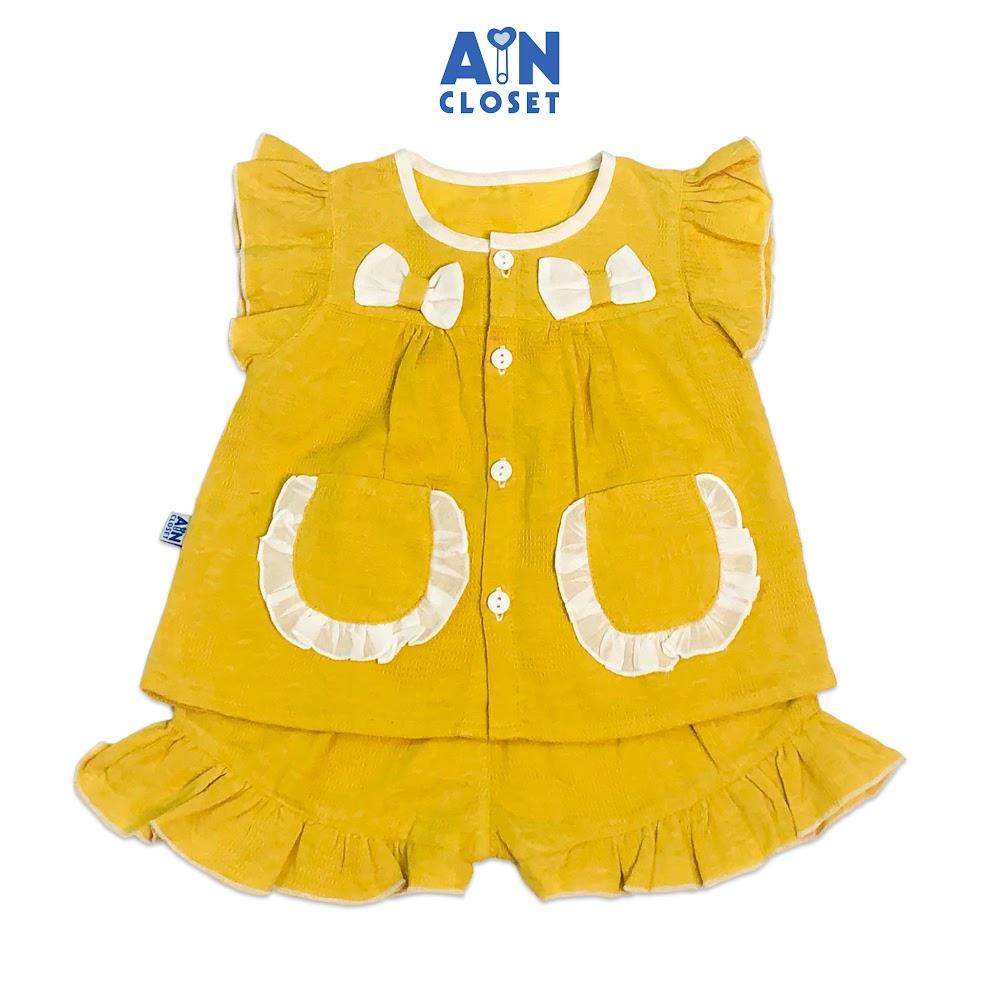 Bộ quần áo ngắn bé gái họa tiết Vàng trơn nơ trắng cotton dệt - AICDBGO9WMHH - AIN Closet