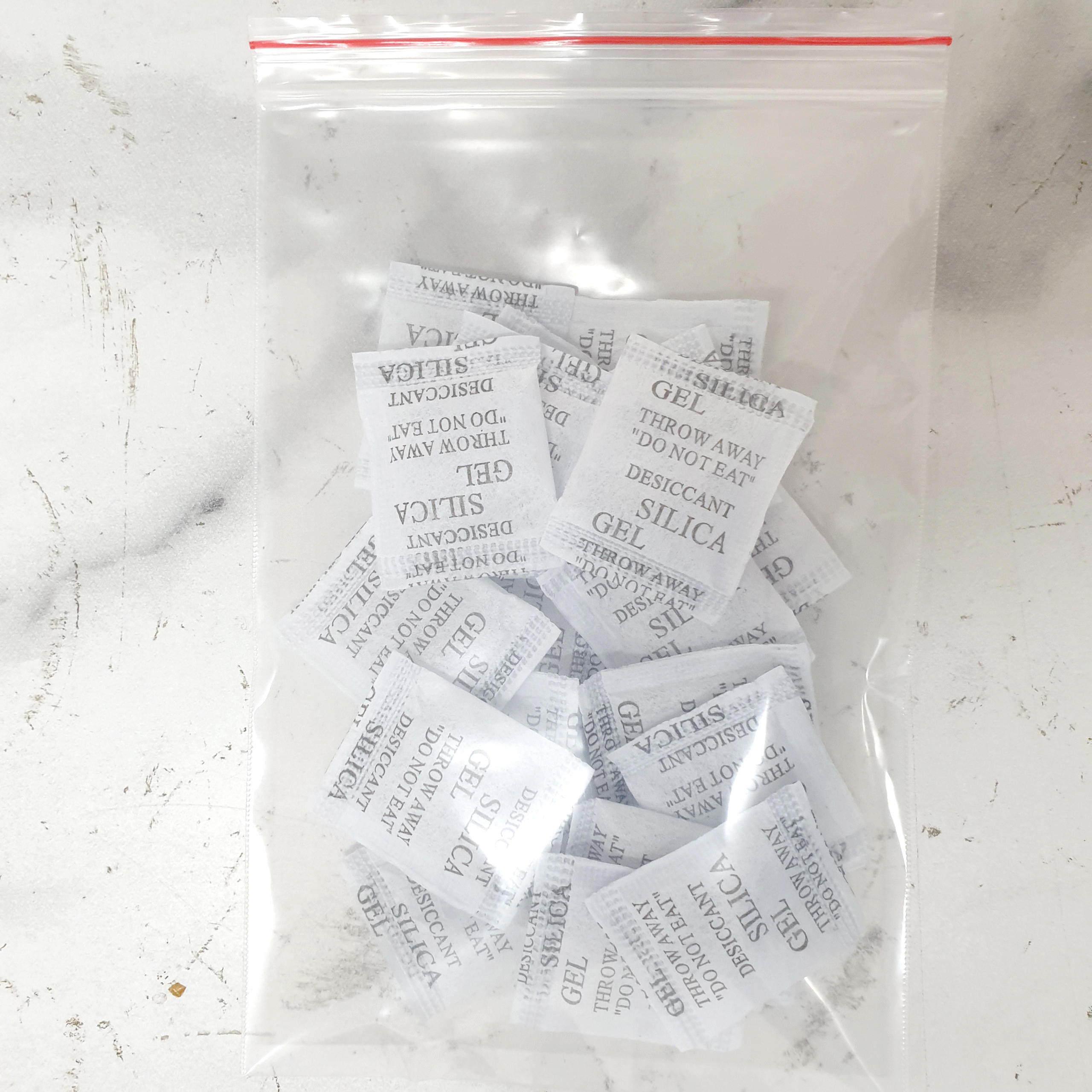Gói hút ẩm (bán lẻ theo gói) - Loại 2g Silica Gel - Hạt chuyên hút ẩm quần áo, giày dép, máy ảnh