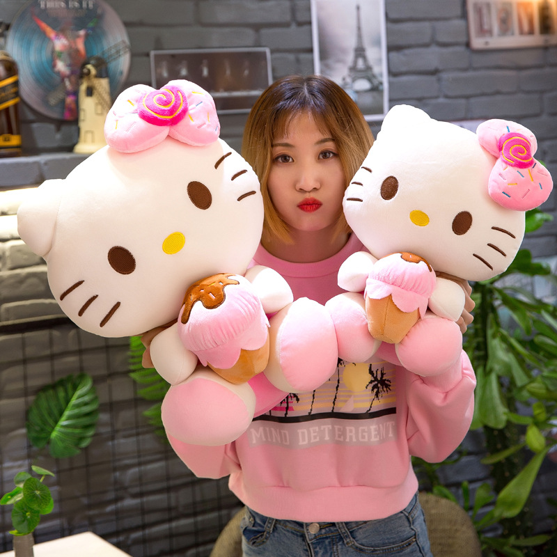 Gấu bông Hello Kitty ôm bánh đeo nơ dễ thương cho bé kích thước 30-40-55cm