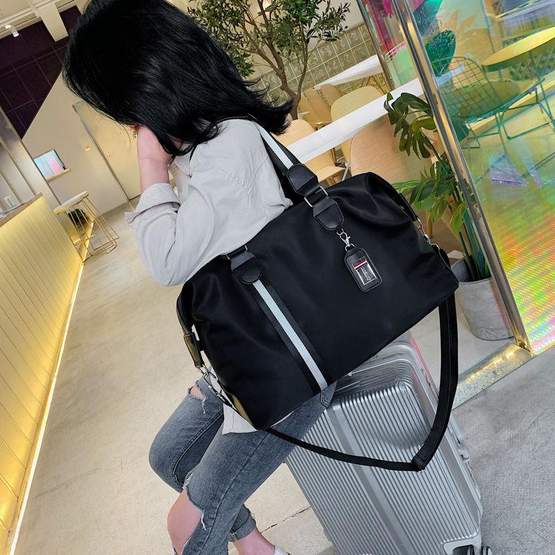 Phong cách mới nhất của túi du lịch nam phát hành túi hành lý sức chứa lớn túi du lịch túi du lịch kinh doanh đường ngắn thể dục ánh sáng xách tay