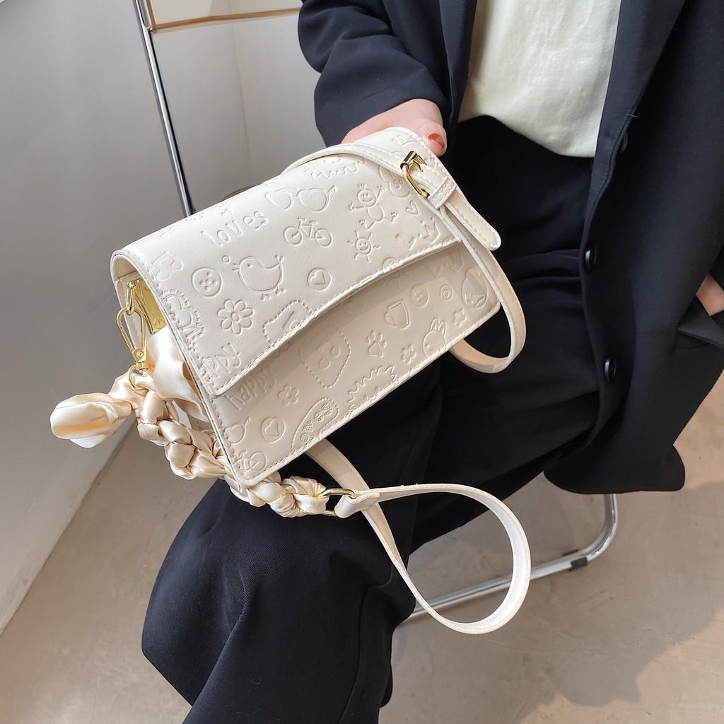 Túi da nữ họa tiết in chìm kute - MA279