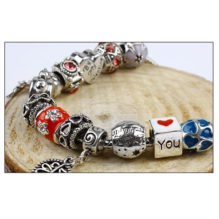 Vòng tay charm đồng hồ và chiếc lá
