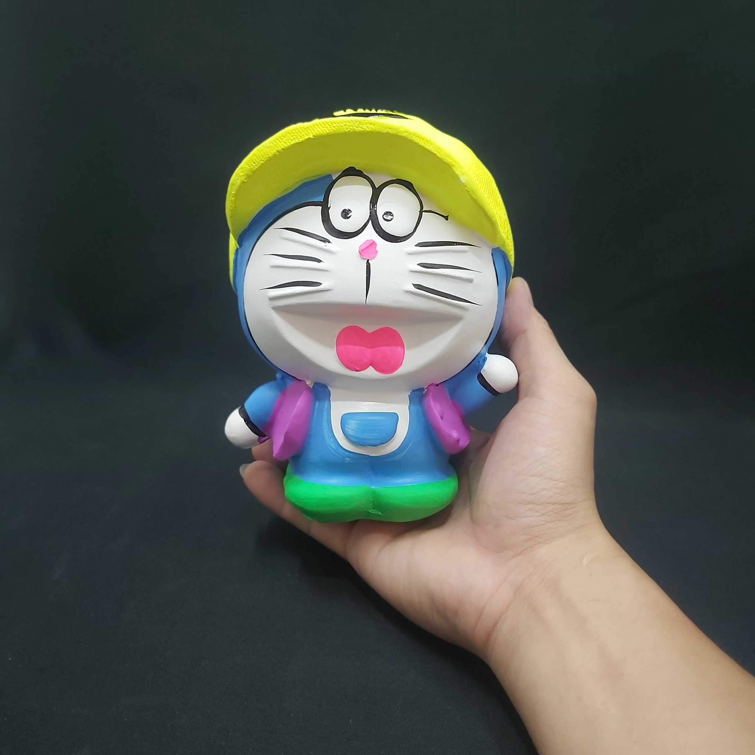 Ống heo tiết kiệm tiền nhỏ mẫu DORAEMON Đội Nón cực HOT – heo đất làm quà tặng sinh nhật được trẻ em yêu thích