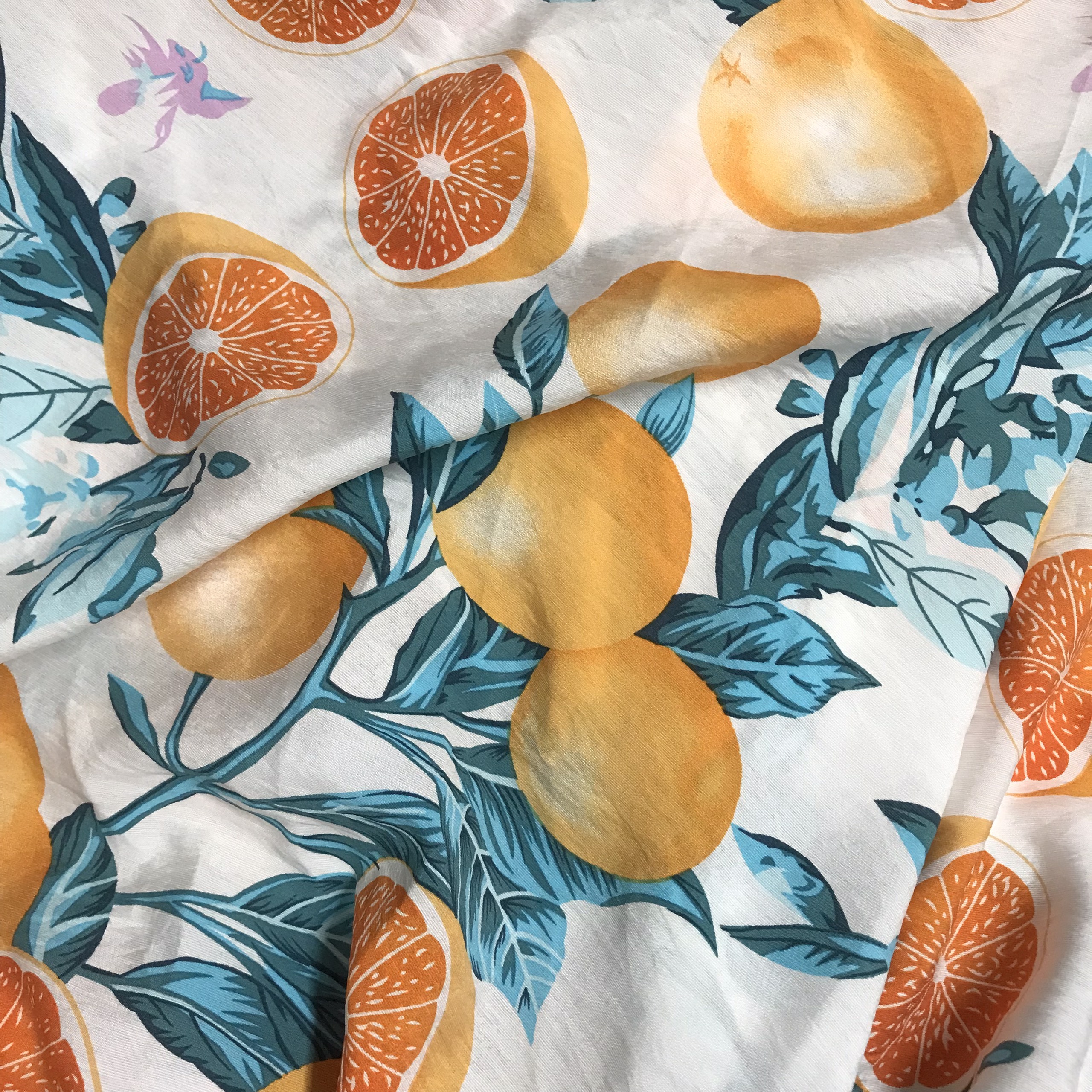 Vải đũi tơ Thái mềm mỏng họa tiết quả cam nền trắng