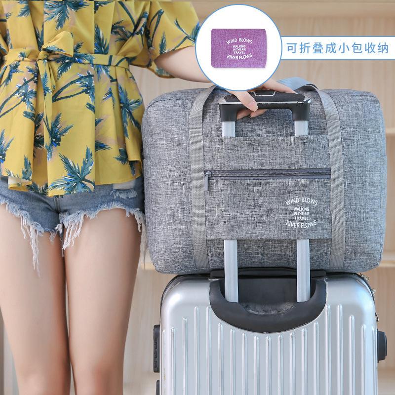 Túi du lịch xách tay siêu lớn chống thấm nước có thể gập lại cho nam và nữ Chuyến công tác ngắn Túi du lịch một vai Túi hành lý xe đẩy