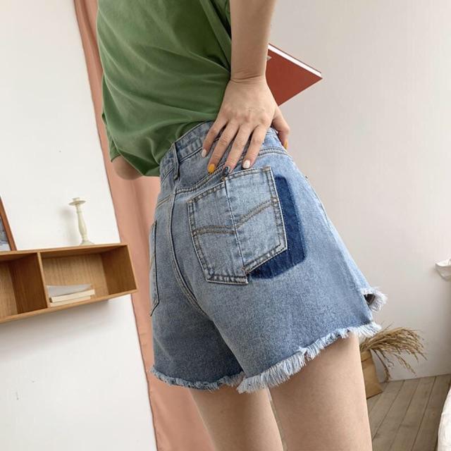 Quần short jean túi so le