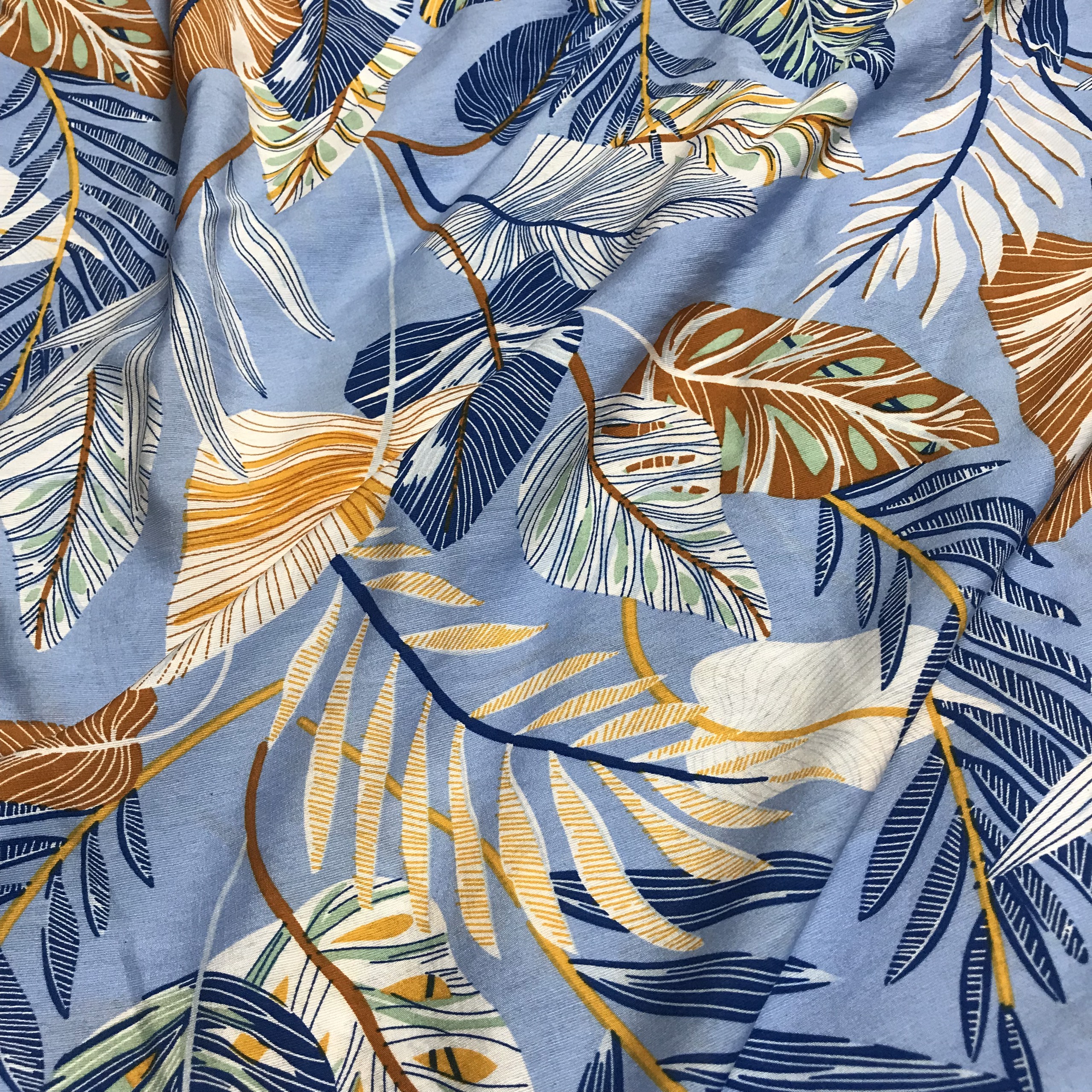 Vải đũi tơ Thái mềm mỏng họa tiết lá cây 2 màu nền xanh lơ