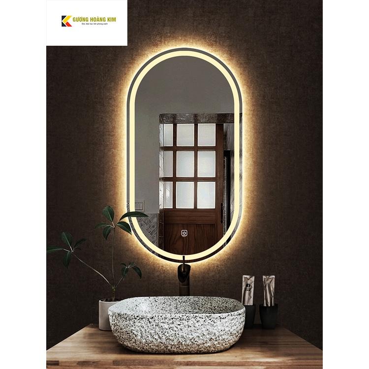 Gương cảm ứng đèn led treo tường oval elip bầu dục nhà tắm phòng wc trang điểm makeup decor phôi gương bỉ AGC cao cấp kích thước 50x90cm và 60x100cm guonghoangkim mã HK-2006