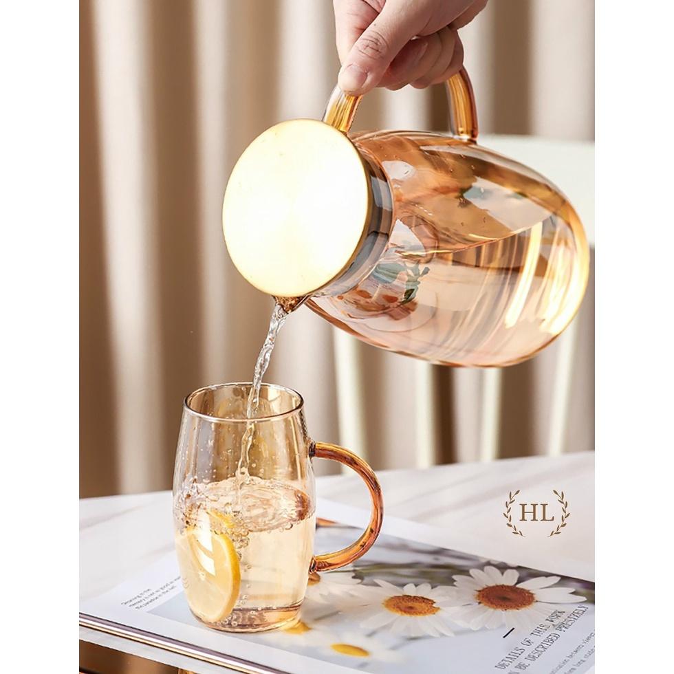 Bình đựng nước uống thủy tinh vàng bầu trơn