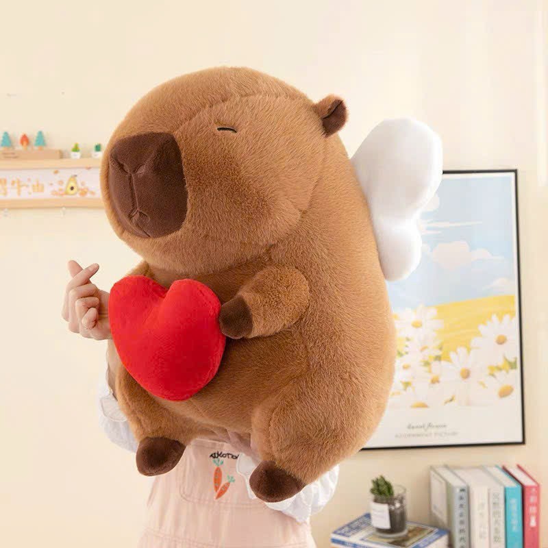 Thú nhồi bông Capybara cánh thiên thần đáng yêu - Size 30cm đến 50cm - Quà tặng gấu bông chuột lang ôm tim cánh trắng êm mịn