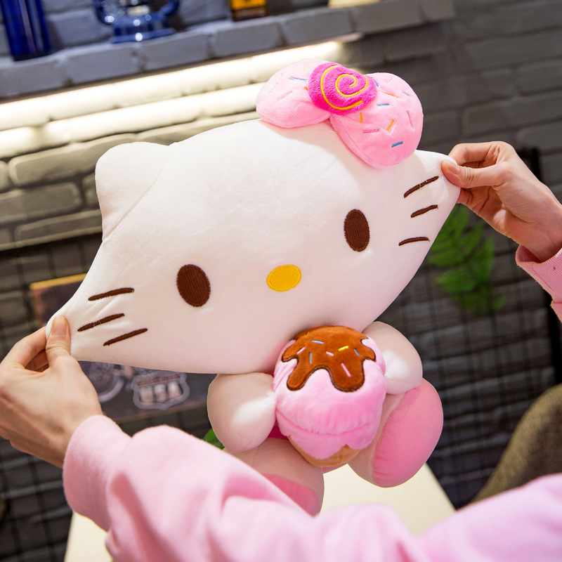 Gấu bông Hello Kitty ôm bánh đeo nơ dễ thương cho bé kích thước 30-40-55cm