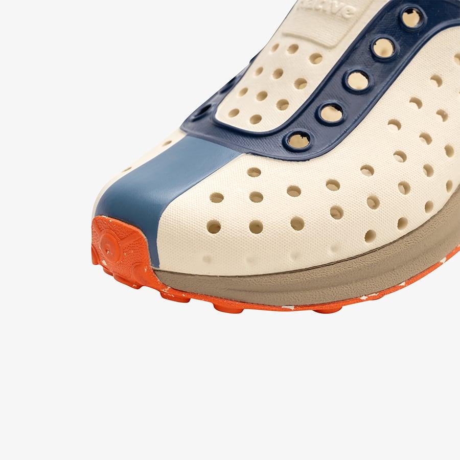 Giày Lười Trẻ Em Unisex Native Robbie Block Junior - Bone White/ Flax Tan/ Oasis Regatta/ La Flame Speckle Rubber - 39