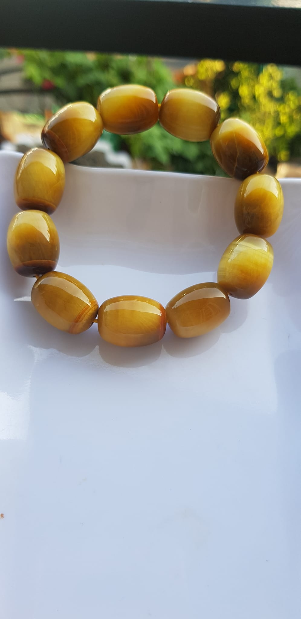 Vòng Tay Phong Thủy Nam Mệnh Thổ Kim Thủy Mới Đẹp Hạt Lu Thống Mới Vàng Nâu bóng đẹp Chất liệu đá mắt hổ tự nhiên vàng nâu bóng đẹp ạ Size hạt 14mm x dài 19mm ạ