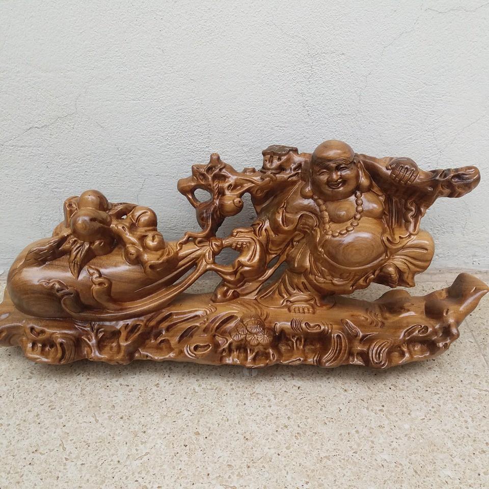 Tượng di lạc kéo bao .gỗ bách sanh -kích thước cao 19cmx40cmx11cm