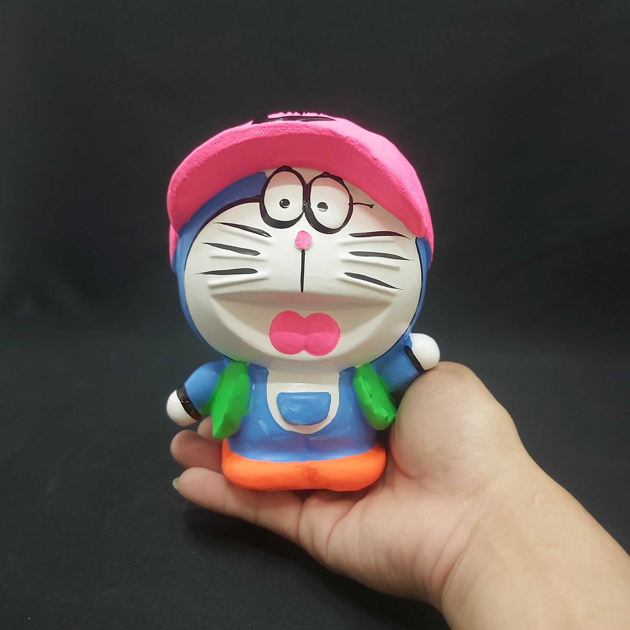 Ống heo tiết kiệm tiền nhỏ mẫu DORAEMON Đội Nón cực HOT – heo đất làm quà tặng sinh nhật được trẻ em yêu thích