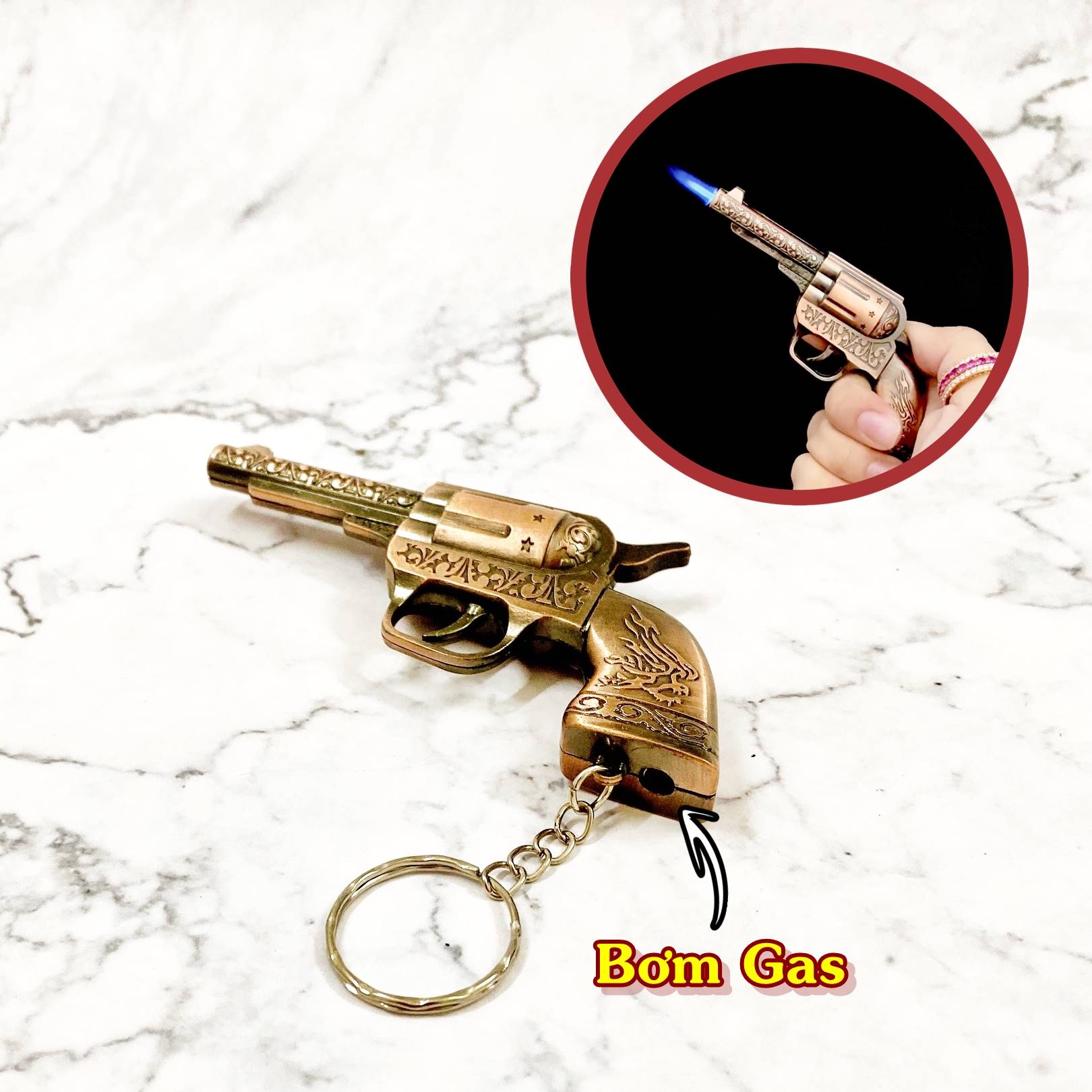 Hột quẹt bật lửa khè móc khóa hình súng hoa văn đồng -