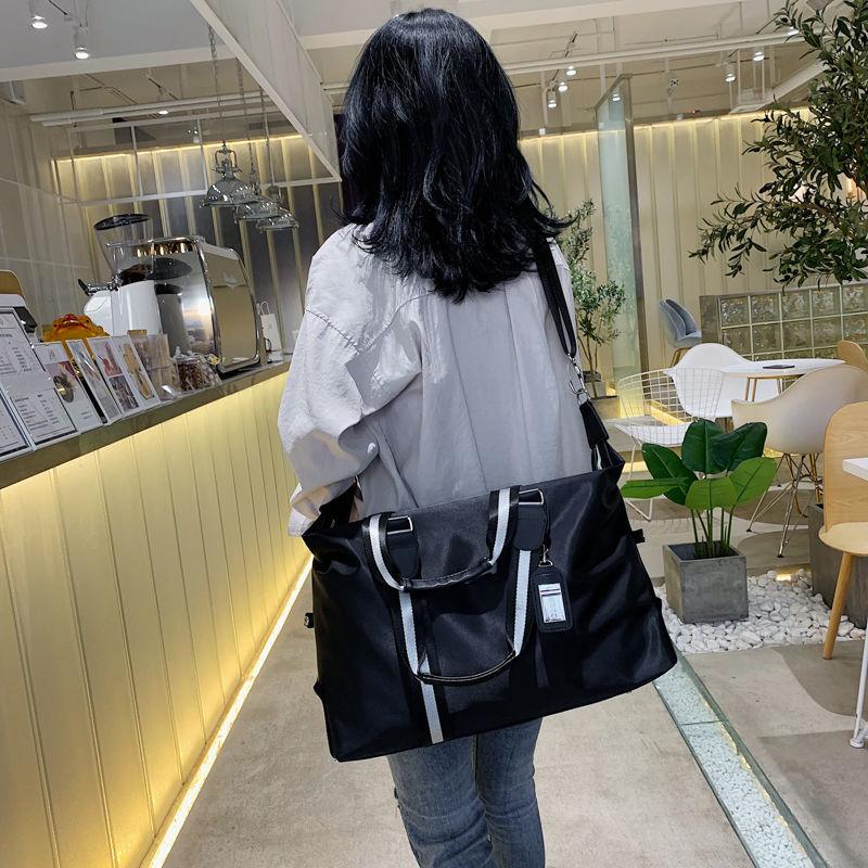 Phong cách mới nhất của túi du lịch nam phát hành túi hành lý sức chứa lớn túi du lịch túi du lịch kinh doanh đường ngắn thể dục ánh sáng xách tay