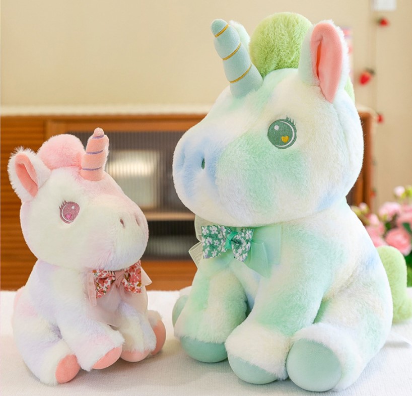 Gấu bông Màu loang Unicorn mắt trái tim đính nơ voan hoa 28cm siêu xinh