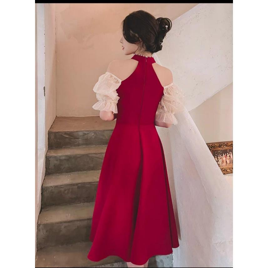 Đầm xoè cổ yếm đính cườm tay phối lưới kim sa