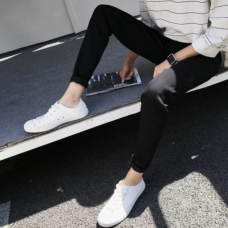 Quần jeans đen rách tua rua
