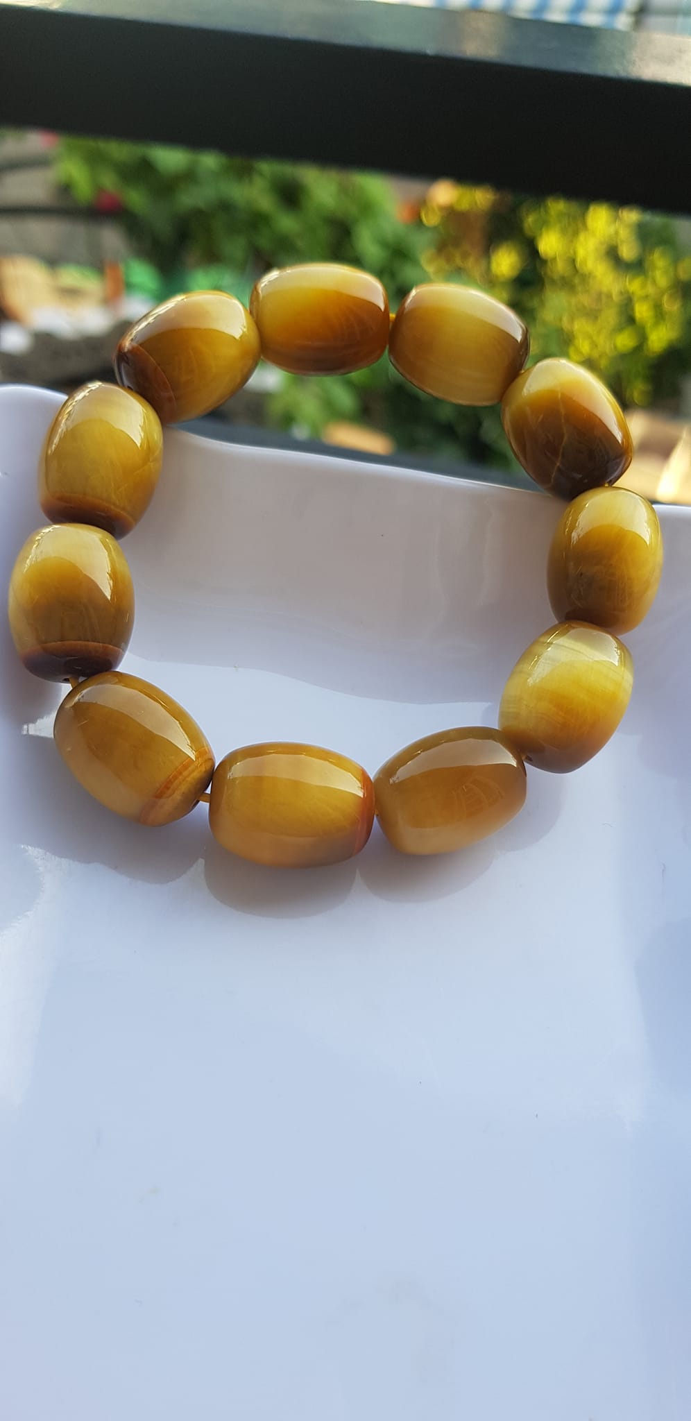 Vòng Tay Phong Thủy Nam Mệnh Thổ Kim Thủy Mới Đẹp Hạt Lu Thống Mới Vàng Nâu bóng đẹp Chất liệu đá mắt hổ tự nhiên vàng nâu bóng đẹp ạ Size hạt 14mm x dài 19mm ạ