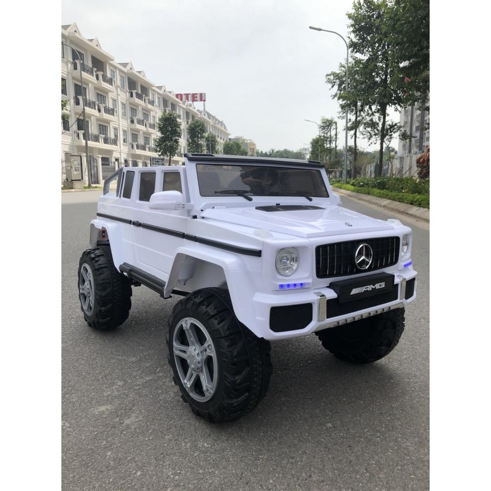 Ô tô xe điện địa hình MERCEDES G650 đồ chơi cho bé 2 chỗ 4 động cơ 12V7AH (Đỏ-Trắng-Đen)