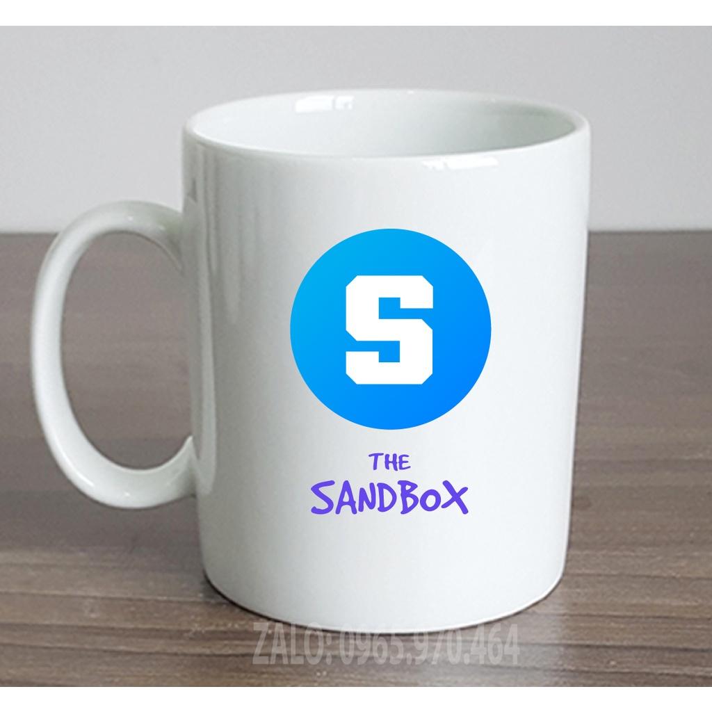 Ly Sứ Có Quai Họa Tiết Đồng Coin THE SANDBOX - In hình lên ly sứ, cốc theo yêu cầu của bạn - HÌNH LỚP, CÔNG TY