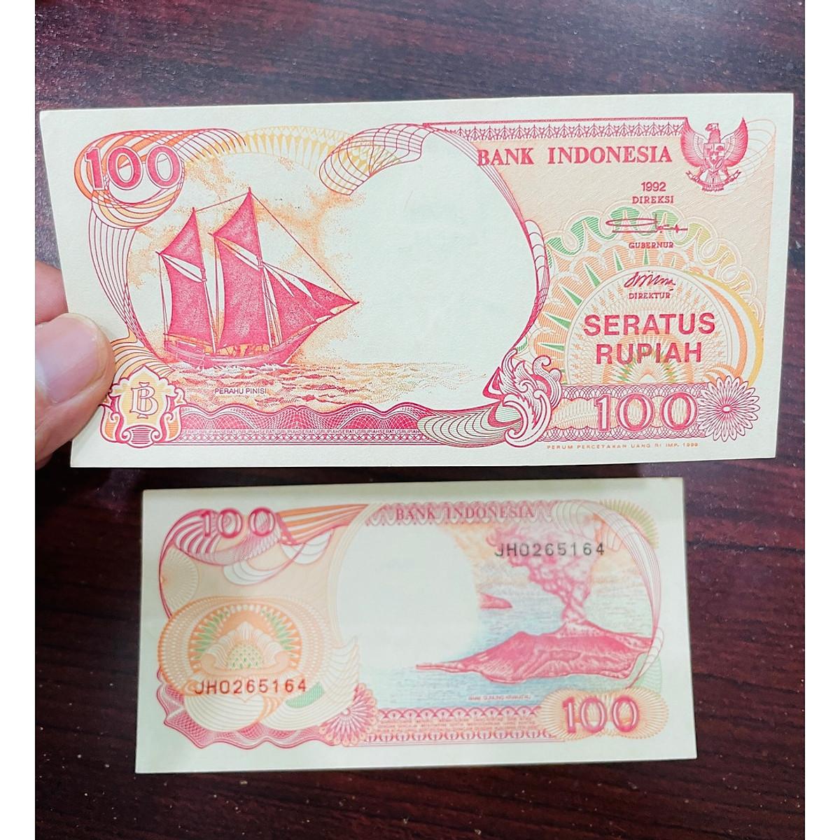 Tiền Indonesia 100 Rupiah thuận buồm xuôi gió, tiền xưa phong thủy , mới 100% UNC, tặng phơi nilon bảo quản