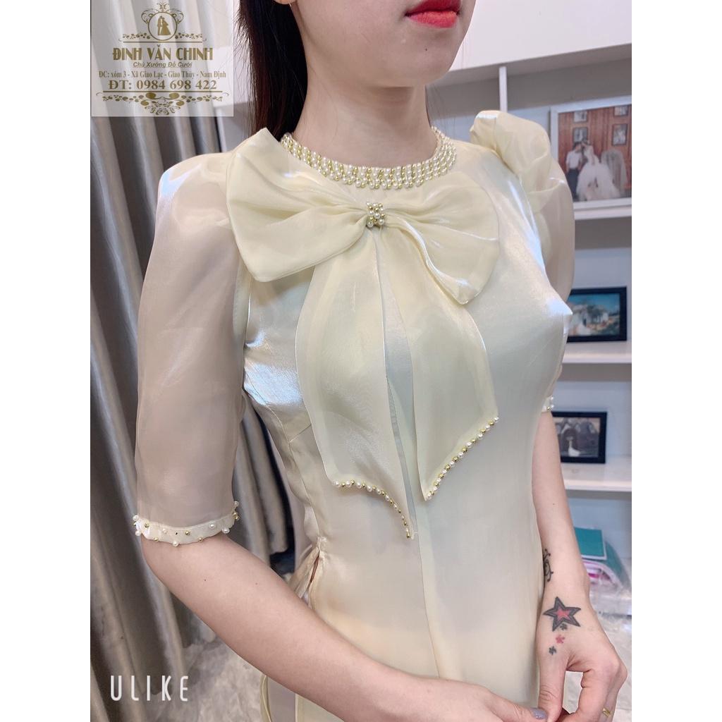 Áo dài tơ sống nơ ngực điểm trai full cổ màu da sáng