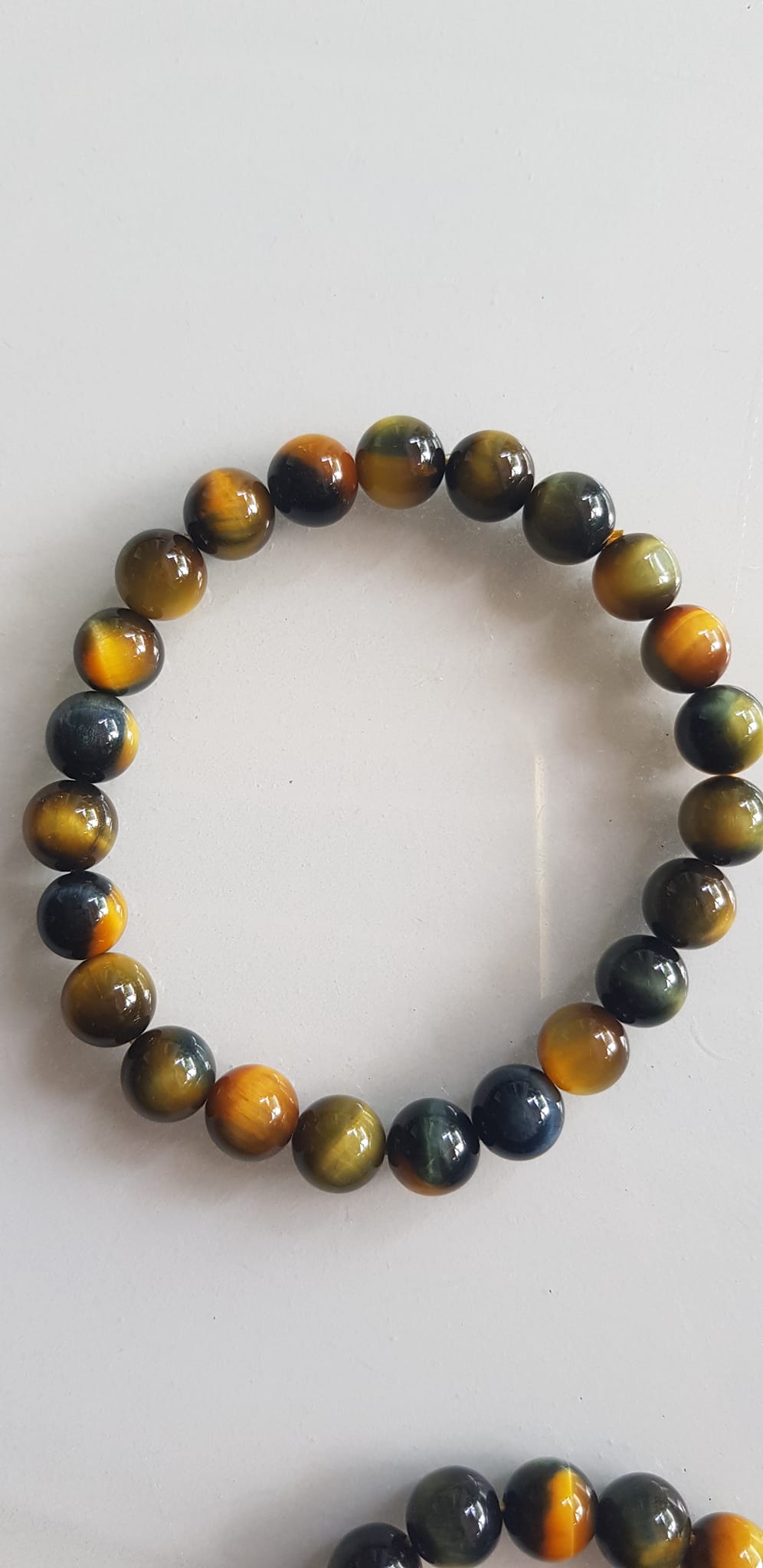 Vòng tay phong thủy may mắn Nữ đá mắt hổ tự nhiên vàng xanh đều mới bóng mượt đẹp Size hạt 8mm Nữ đeo Công dụng vòng đá mắt hổ đá thiên nhiên tốt cho sức khỏe, đem đến may mắn,xoa dịu tâm trí công việc hanh thông ạ