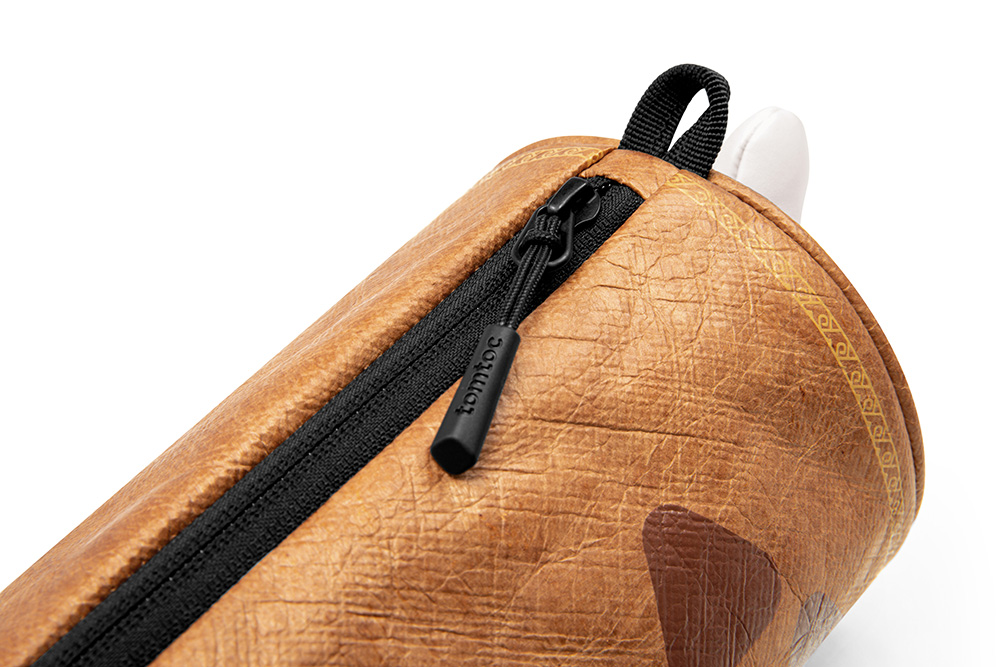 Túi Đeo Chéo TOMTOC MHRS-T14 Monster Hunter Steak Brown Gọn Nhẹ Linh Hoạt Thiết Kế Hình Trụ Cho Nhiều Không Gian Chứa Hàng Chính Hãng