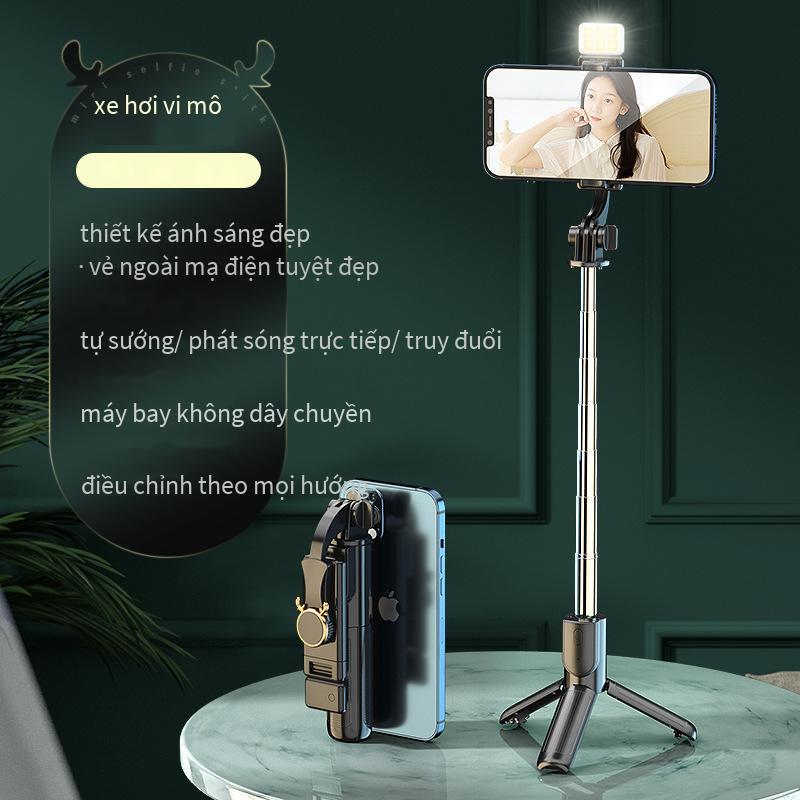 Phong cách mới nhất mini ba chân tất cả trong một selfie stick lưới màu đỏ phát sóng trực tiếp ngoài trời di động cầm tay bluetooth chống rung tạo tác vẻ đẹp