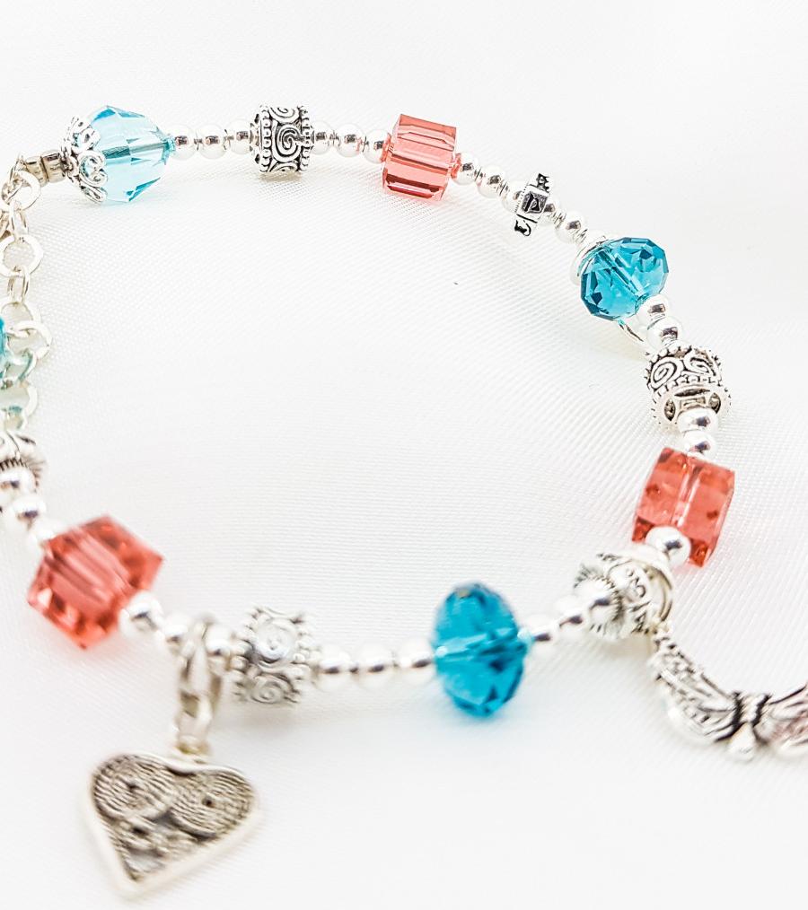 Vòng tay mệnh đá pha lê mix charm hoa+ tim