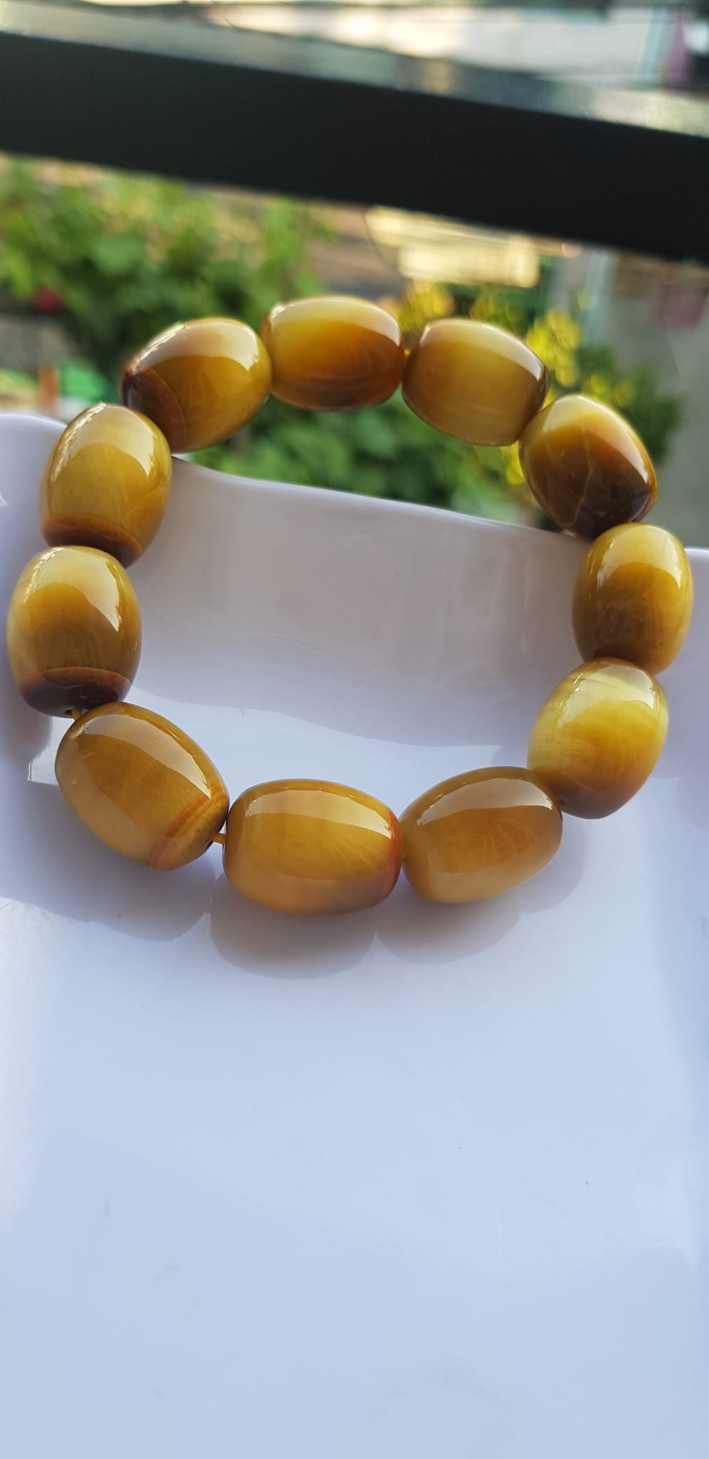 Vòng Tay Phong Thủy Nam Mệnh Thổ Kim Thủy Mới Đẹp Hạt Lu Thống Mới Vàng Nâu bóng đẹp Chất liệu đá mắt hổ tự nhiên vàng nâu bóng đẹp ạ Size hạt 14mm x dài 19mm ạ